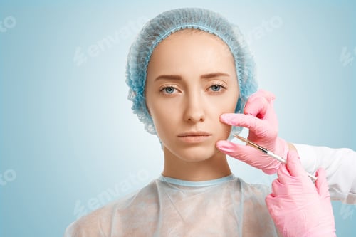 Preview: Close Up Of Young Caucasian Woman Getting Anti-Aging Injections In Beauty Clinic. Headshot Of