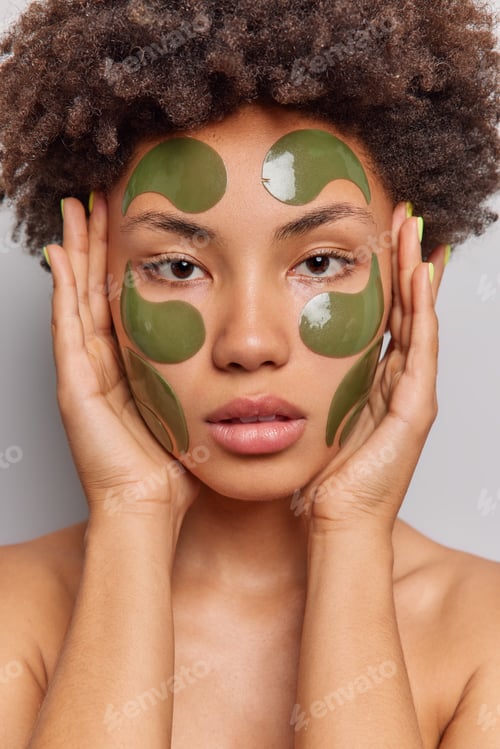 Preview: Close Up Shot Of Natural Young Female Model Keeps Hands On Face Enjoys Softness Of Skin Takes Care