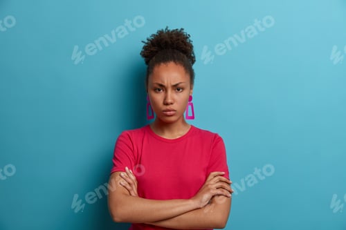 Preview: Offended Angry African American Woman Has Bad Mood, Frowns Face And Stands Distressed, Being