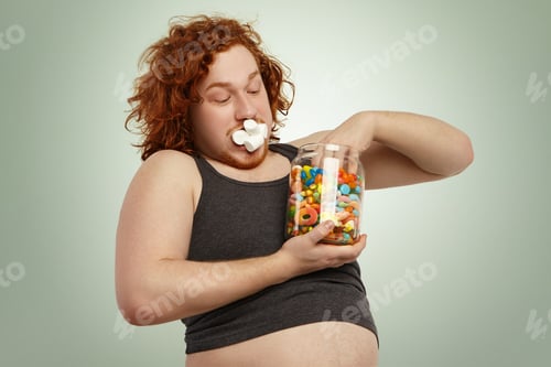 Preview: Obese Overweight Young European Redhead Man Dressed In Undersized Tank Top Posing At Studio Wall