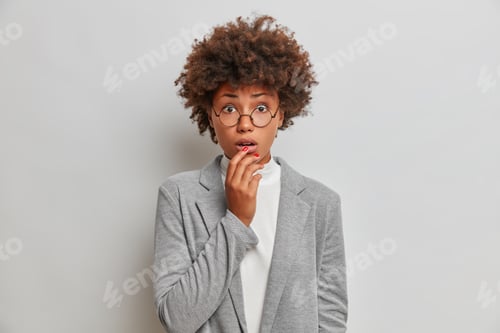 Preview: Concerned Nervous Female Entrepreneur Holds Breath During Troublesome Moment, Keeps Hand On Lips