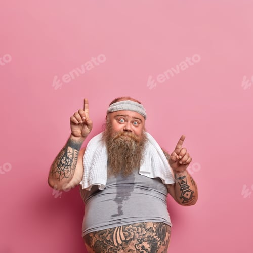 Preview: Vertical Shot Of Bearded Caucasian Adult Man Gets Sweaty During His Training Session, Works Hard On