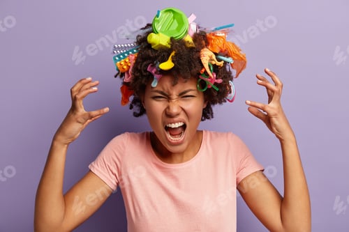 Preview: Horizontal Shot Of Dissatisfied Emotional Annoyed Young Woman Gestures Actively Over Head With