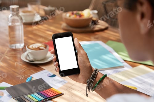 Preview: Unrecognizable Ethnic Young Woman Holds Modern Smart Phone With Blank Screen, Syncronizes