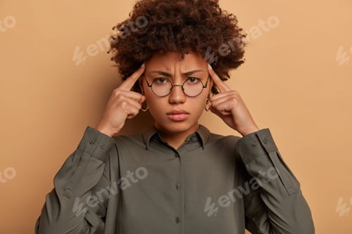 Preview: Intense Displeased Woman Touches Temples With Index Fingers, Feels Severe Headache, Cannot Continue