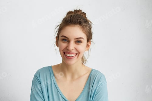 Preview: Smiling Woman with Updo Against White Background