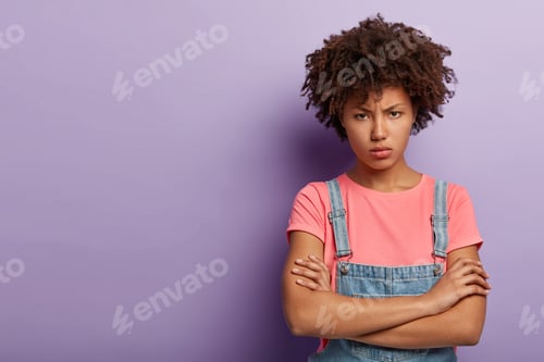 Preview: Portrait Of Dissatisfied Angry Woman Offended After Quarrel With Boyfriend, Keeps Arms Folded, Has