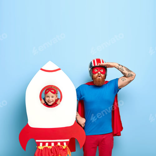 Preview: Super Father Wears Mask, Blue T Shirt And Red Cloak, Looks Surprisingly Into Distance, Plays With