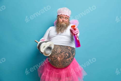 Preview: Bearded Surprised Obese Man With Tattooed Belly Holds Detergent And Plunger Does Household Duties