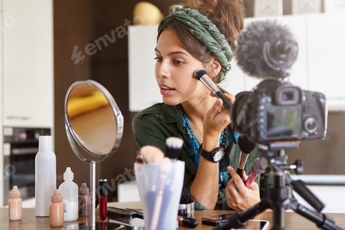 Preview: Candid Shot Of Stylish Woman Testing New Cosmetic Products And Recording Process On Video Camera