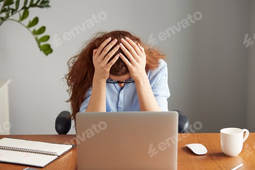 Preview: Top View Portrait Of Dissatisfied Young Female Office Worker Looking Unhappily At The Camera