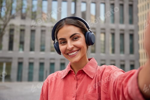 Preview: Millennial Girl Has Perfect Smile Dressed Casually Wears Wireless Headphones On Ears Listens