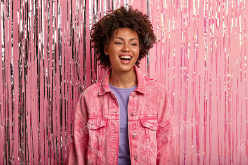 Preview: Young Smiling African American Female Has Minimal Make Up, Wears Pink Jacket, Laughs Positively