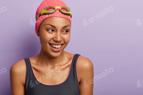 Preview: Active Smiling Dark Skinned Female Swimmer Prepares For Competition, Being Wet After Diving