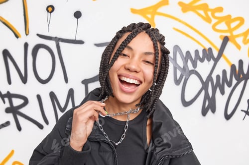 Preview: Millennial Teenagers And Trendy Youth Culture Concept. Positive Ethnic Hipster Girl Smiles Broadly