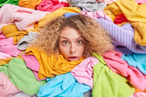 Preview: Wardrobe Arrangement. Womans Head Sticking Through Pile Of Colorful Clothes Involved In Old