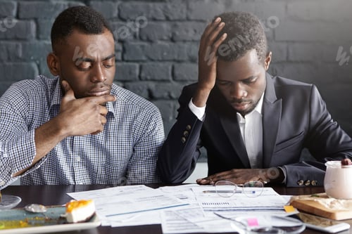 Preview: People, Business And Failure. Two Tired And Depressed African-American Businessmen Doing Paperwork