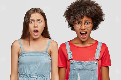 Preview: Photo Of Indignant Annoyed Multiethnic Women Scream Agrily, Dressed In Casual Clothes, Stand
