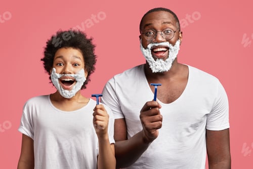 Preview: Photo Of Happy Schoolboy With Afro Hairdo Attempts To Shave Like His Dad, Applies Shaving Gel On