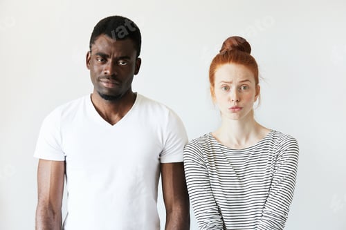 Preview: Interracial Love And Friendship. African Male And Redhead Caucasian Woman Looking At The Camera