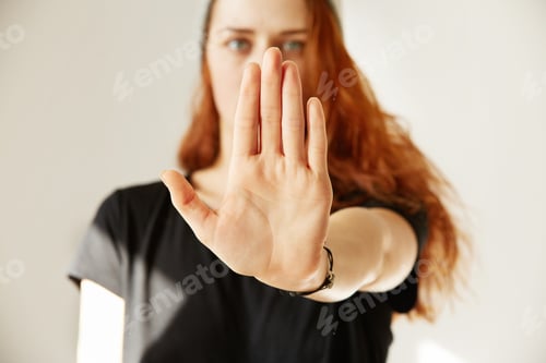Preview: Close Up View Of Young Woman Making Stop Gesture With Her Hand. Cropped Isolated Portrait Of