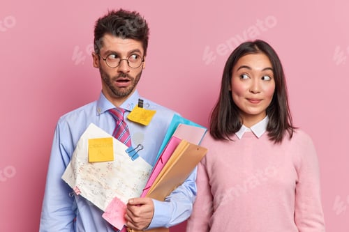 Preview: Surprised Mixed Race Female And Male Colleagues Have Deadline To Prepare Project Look Surprisingly