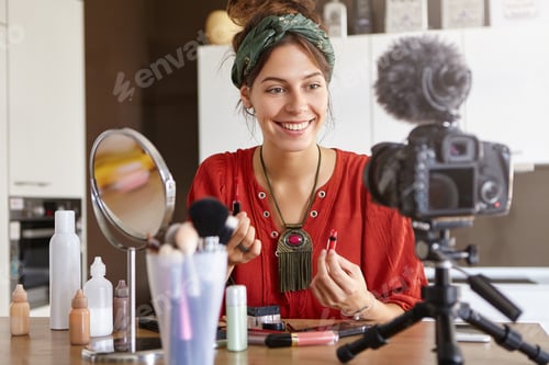 Preview: Video Blogging Concept. Attractive Young Woman Sitting In Shooting Area, Having Web Television