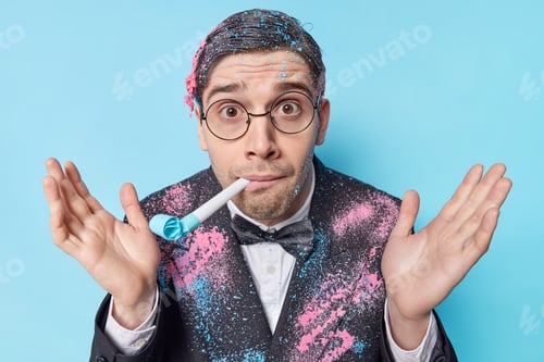 Preview: Surprised Handsome Birthday Man Blows Party Horn Keeps Palms Raised Looks Wondered Wears Round