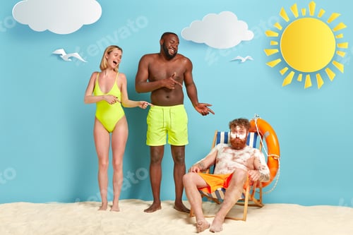 Preview: Mixed Race Woman And Man Laugh At Funny Friend Covered With White Burn Cream, Has Sunburnt Skin