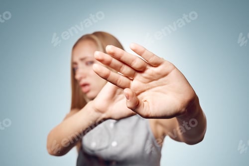 Preview: Irritated Woman Showing Her Hand Against Please Stop. Negative Emotion Facial Expression Feelings
