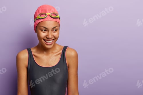 Preview: Isolated Shot Of Dark Skinned Woman Athelete Covers Distance Swimming, Has Healthy Dark Wet Skin