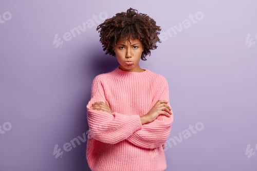 Preview: Upset Dark Skinned Young Lady Has Dejected Facial Expression, Crosses Hands Over Chest, Offended