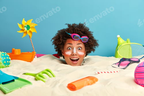 Preview: Happy Surprised Afro American Woman Spends Summer Vacation At Resort Place On Island, Poses At