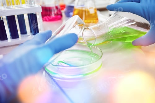 Preview: Researcher Is Dropping The Reagent Into Test Tube For Reaction Testing In Chemical Laboratory