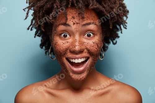 Preview: Close Up Of Happy Black Woman Has Scrub Mask, Smiles Broadly, Has Face Treatments. People, Wellness