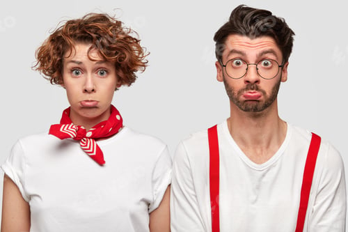 Preview: Displeased Curly Caucasian Female In Casual T Shirt And Bandana On Neck, Purses Lower Lip And Her