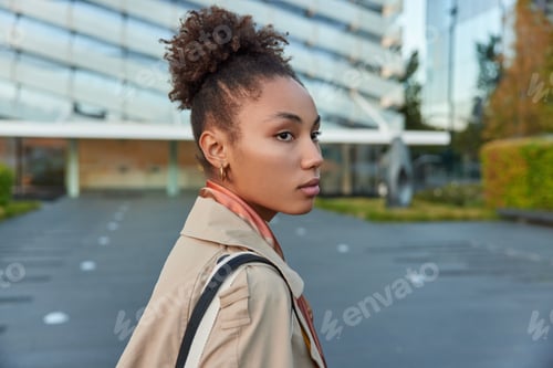 Preview: Young Woman Poses in a Stylish Trench Coat