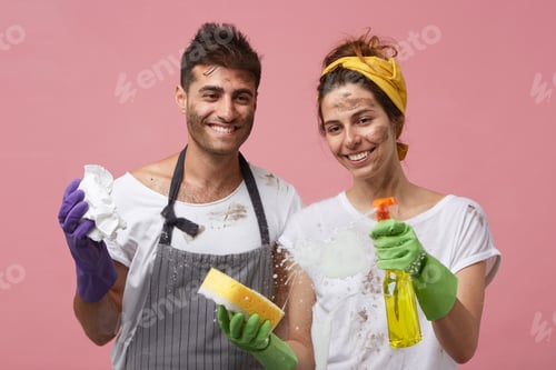Preview: Happy Smiling Couple Washing Glass Surface Wiping Out Foam Using Sponges, Paper And Detergent