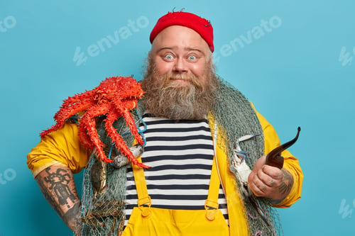 Preview: Photo Of Bearded Experienced Sailor Poses With Fishing Net, Big Red Crab On Shoulders, Smoke Pipe