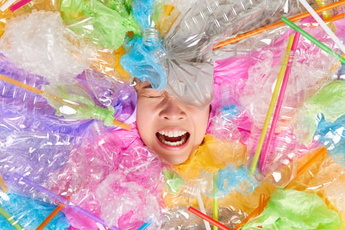 Preview: Depressed Stressed Young Woman Covered With Plastic Litter Fed Up Of Pollution And Environmental