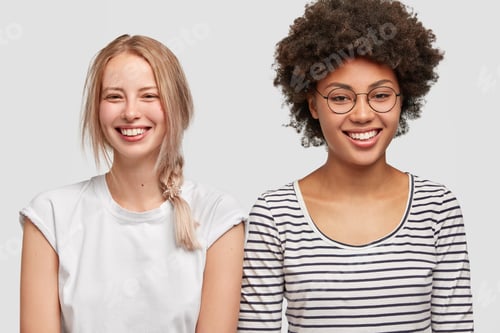 Preview: Multiracial Lesbian Couple Have Positive Expressions. Happy Young Blonde European Woman And Her