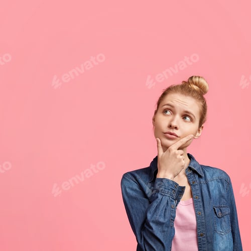 Preview: Beautiful Blonde Female Model Holds Chin, Wears Fashionable Clothes, Looks Pensively Upwards