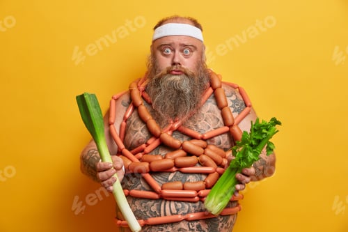 Preview: Surprised Bearded Man Holds Fresh Vegetables, Keeps To Diet, Doesnt Eat Junk Food, Wears Headband