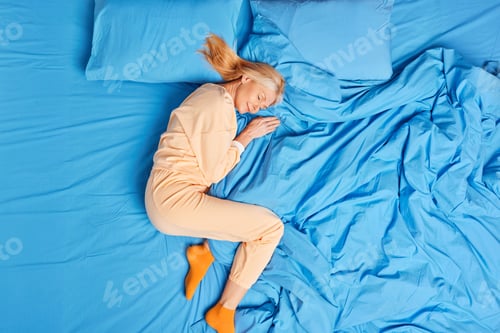 Preview: Above Shot Of Nice Grandmother Sleeps Well In Comfortable Bed Enjoys Seeing Pleasant Sweet Dreams