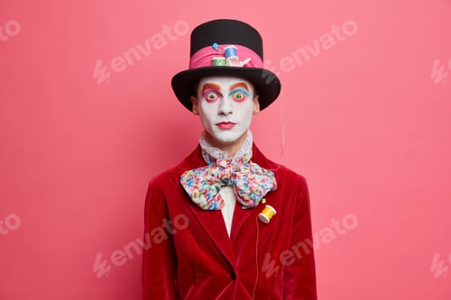 Preview: Surprised Male Hatter Wears Hat Bowtie And Red Velvet Jacket Being Present On Halloween Carnival