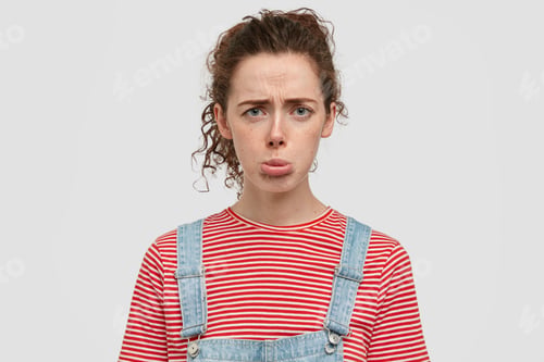 Preview: Photo Of Dissatisfied Dejected Woman Purses Lips, Frowns Face, Has Spoiled Day At University, Wears
