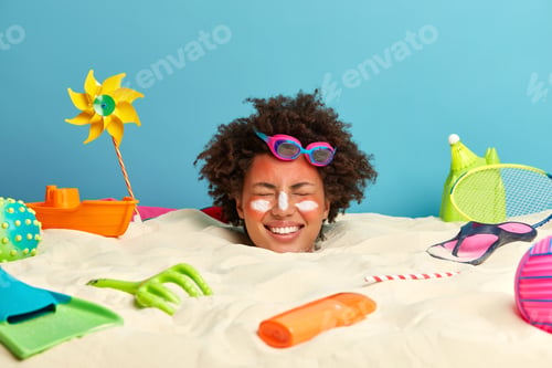 Preview: Smiling Optimistic Woman With Afro Hairstyle Closes Eyes And Smiles Broadly, Wears Swimming