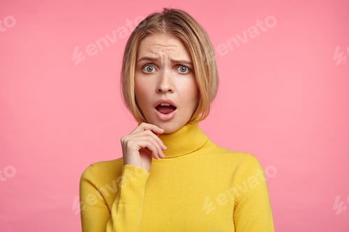 Preview: Horizontal Portrait Of Beautiful Stupefied Woman Keeps Mouth Opened, Has Upset Expression, Dressed