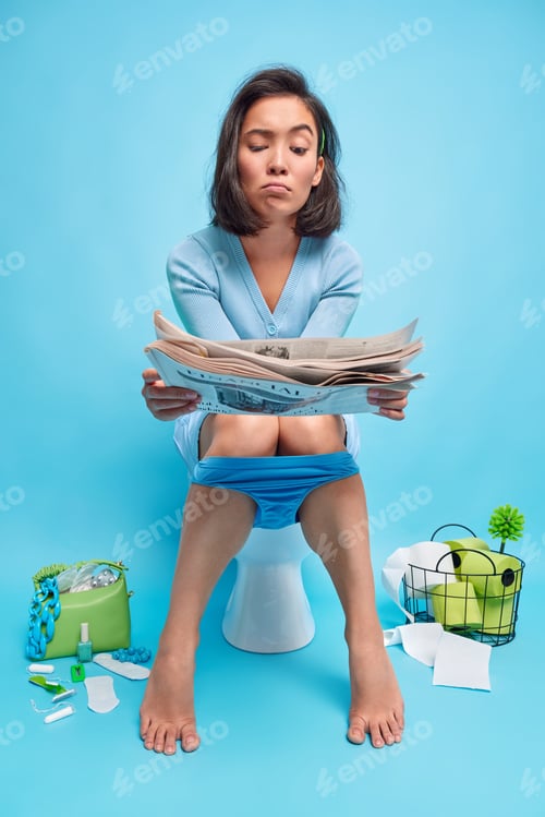 Preview: Human Necessity Concept. Dissatisfied Young Asian Woman Reads Newspaper With Unhappy Expression