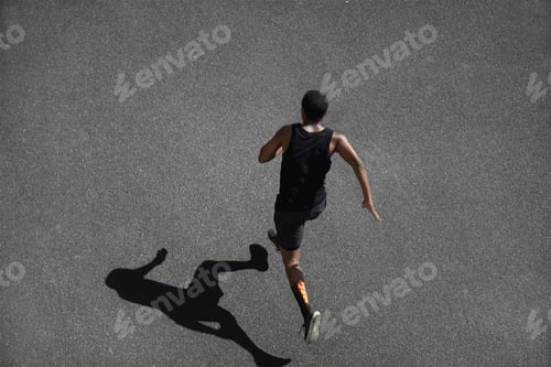 Preview: Top View Of Running Man Sprinting For Success On Run. African Muscular Runner Or Jogger Dressed In